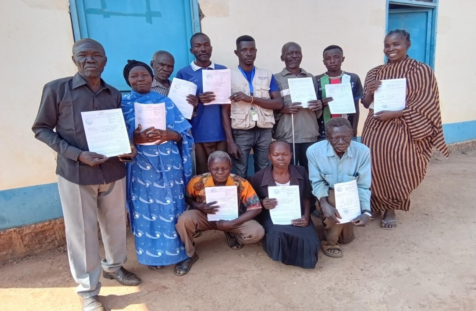 A group of beneficiaries upon receipt of their land documents in Wau Municipality. © IOM/2024