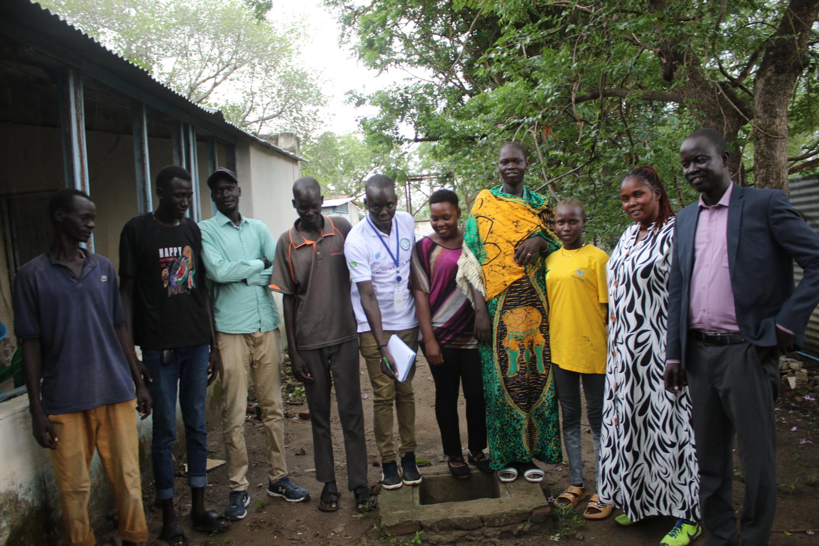 Participants pose for a group photo after the Focus Group Discussion